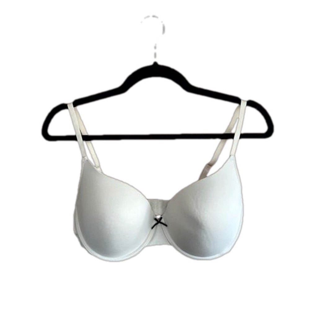 Lightly lined underwire cream with black bow bra size 38D